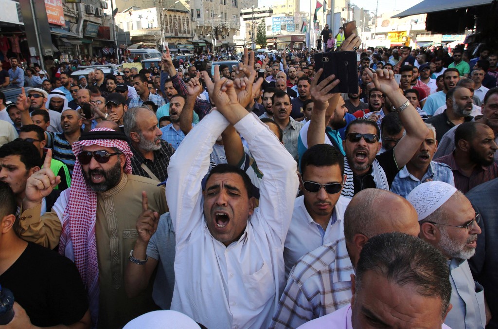 Protestors chant slogans in the Jordanian capital Amman on July 15, 2017 during a demonstration against the closure of the Al-Aqsa mosque compound in Jerusalem