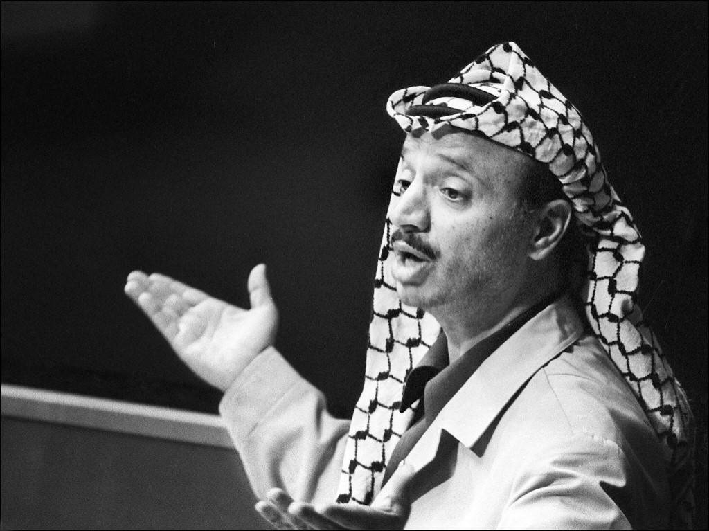 PLO leader Yasser Arafat speaks before the UN General Assembly in 1974 (AFP)