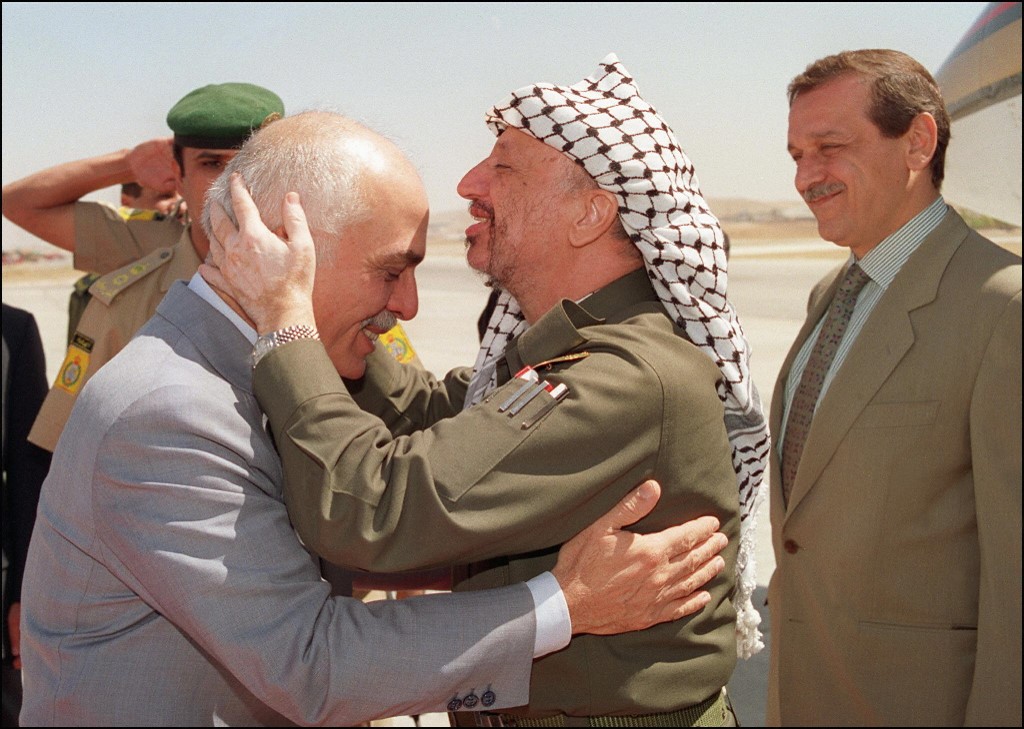 Former Palestinian leader Yasser Arafat greets Hussein in Amman in 1993 (AFP)