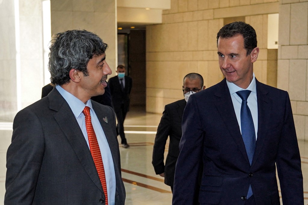 Syrian President Bashar al-Assad receives UAE Foreign Minister Sheikh Abdullah bin Zayed in Damascus on 9 November 2021 (SANA/AFP)