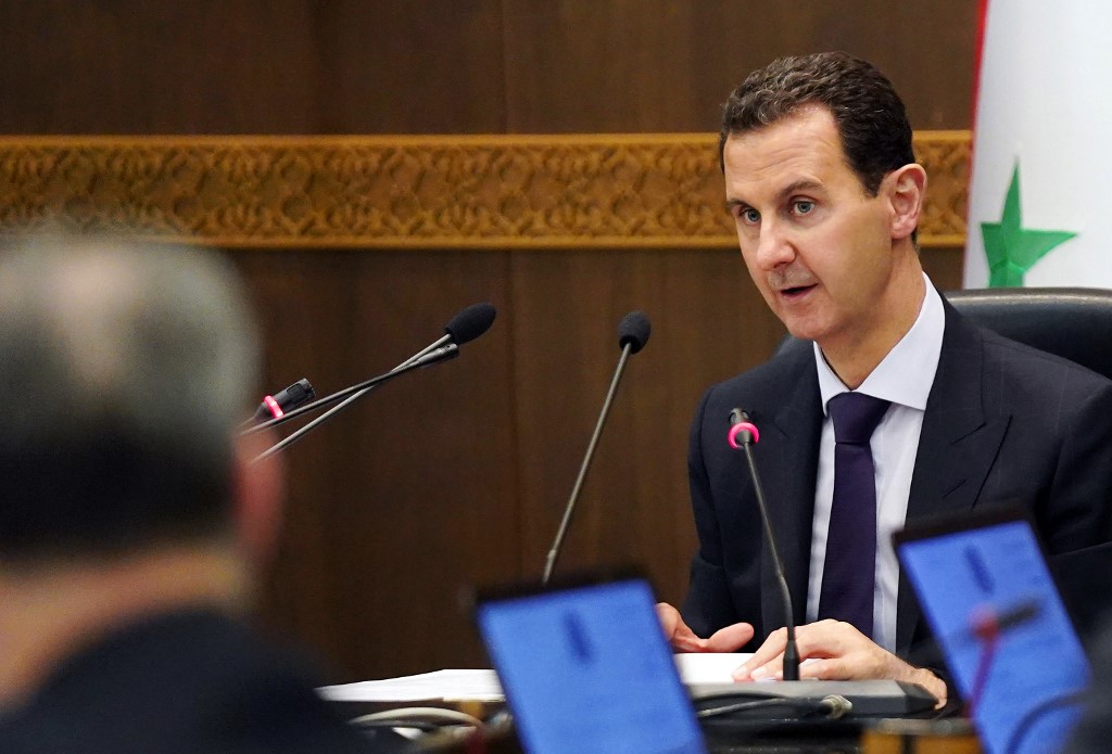 Syrian President Bashar al-Assad is seen in Damascus on 14 May (Handout/SANA/AFP)