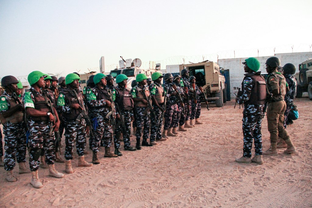 Police officers of the African Union's peacekeeping mission in Somalia (AMISOM) from Uganda, Kenya, Sierra Leone, Nigeria, Ghana and Zambia gather before their night patrol deployment at the base in Mogadishu on September 17, 2019.