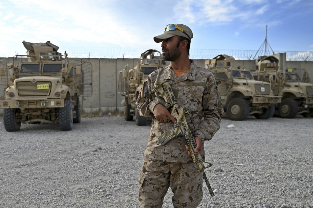 An Afghan police officer stands guard at the Bagram US air base after all US and NATO troops left on 5 July 2021 (AFP)