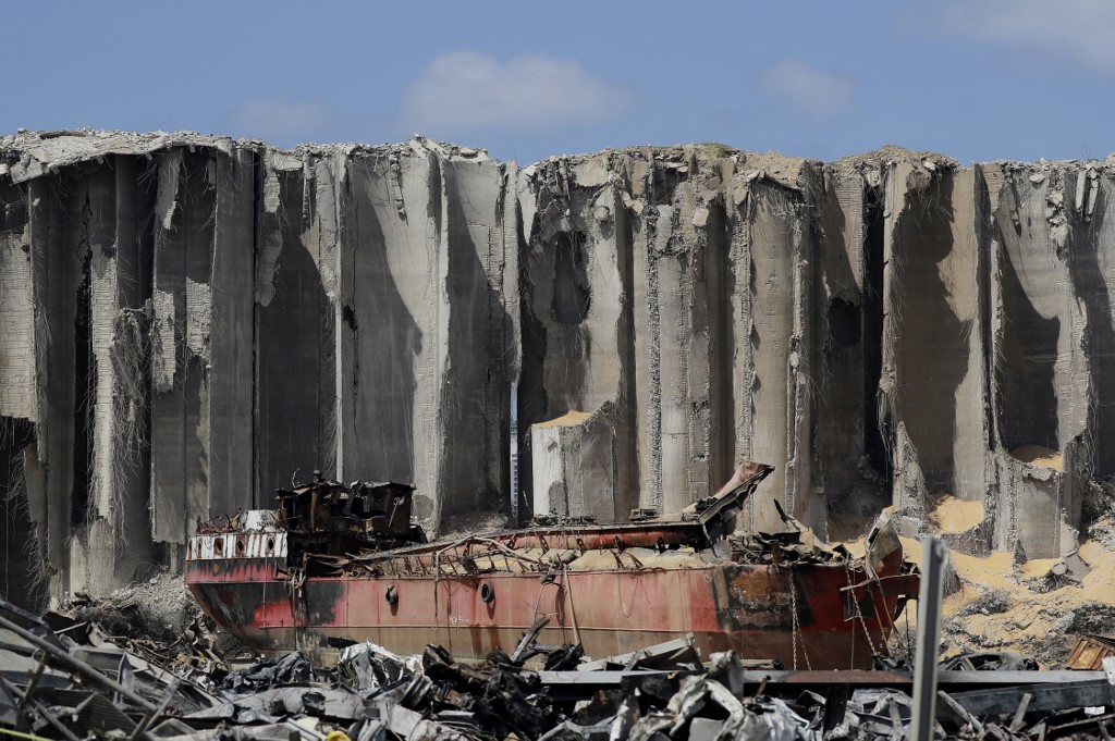 Damaged grain silos stand at the port of Beirut on 26 August (AFP)