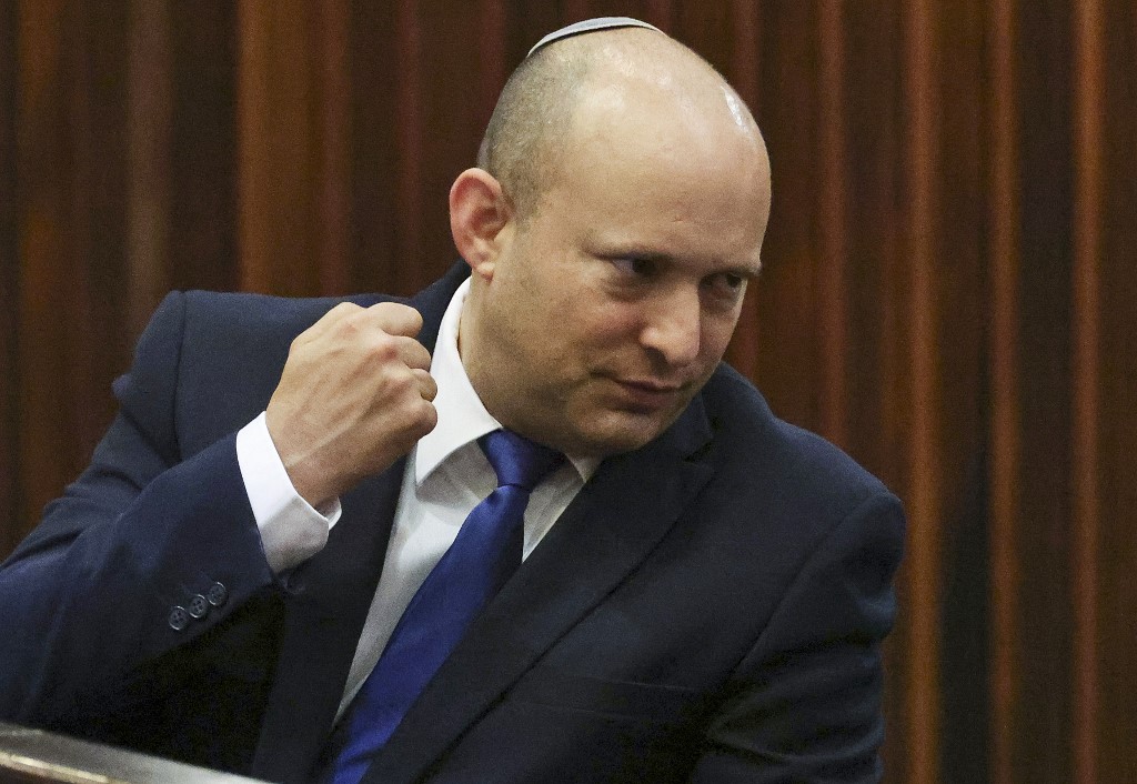 Bennett, set to serve first as prime minister, attends a special Knesset session on 2 June 2021 (AFP)