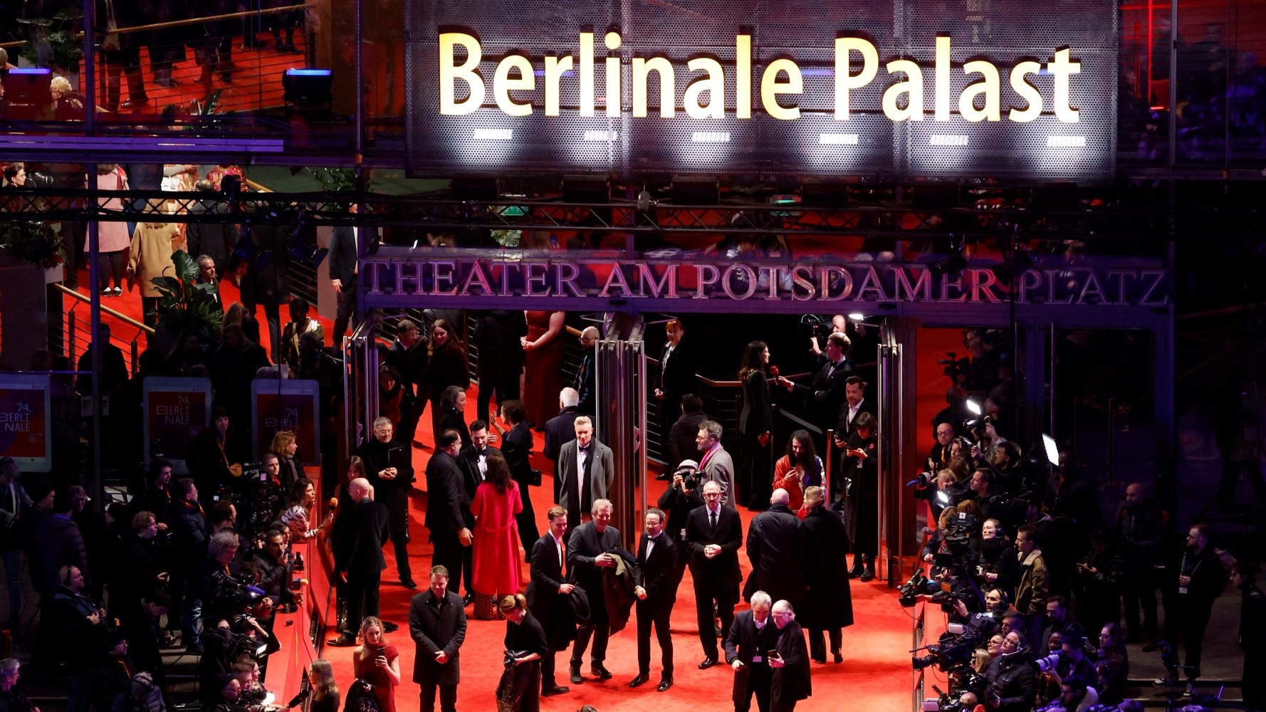 Attendees arrive at the opening of the 74th Berlinale on 15 February