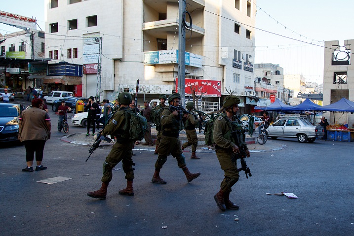 Israeli soldiers patrolling the streets of Hebron on Wednesday (MEE/Miriam Deprez)