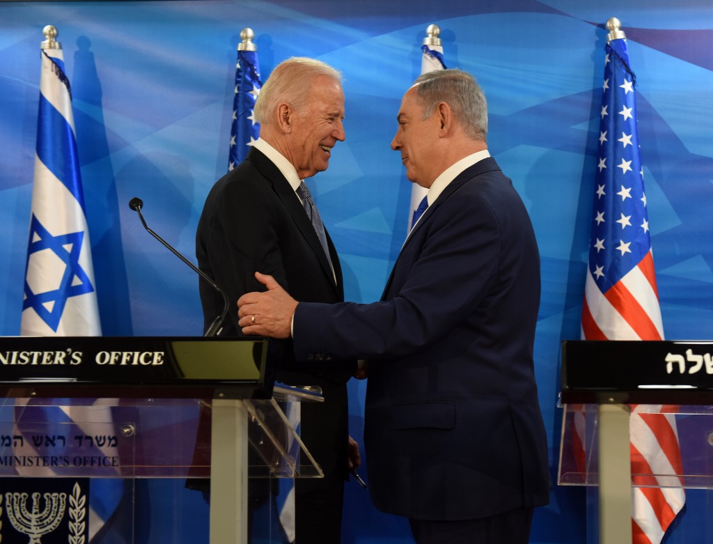 Biden and Israeli Prime Minister Benjamin Netanyahu shake hands in Jerusalem in 2016 (AFP)