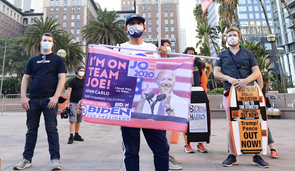 Biden supporters gather for a rally in Los Angeles on 4 November (AFP)