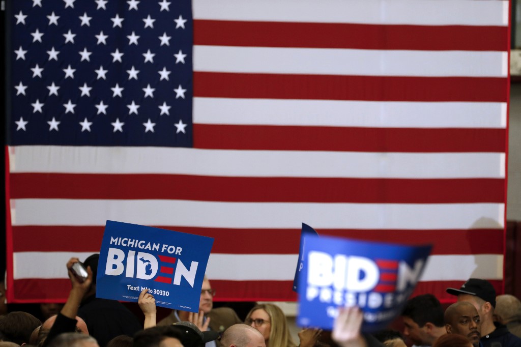 Biden supporters attend a campaign rally in Michigan on 9 March (AFP)
