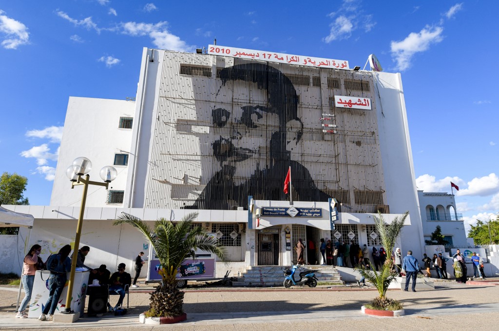 A portrait of Mohamed Bouazizi is seen in Sidi Bouzid, Tunisia, on 27 October (AFP)