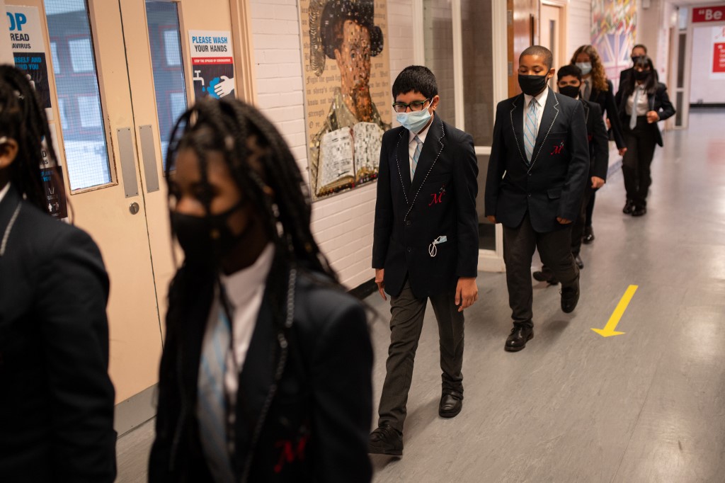 Students wear face masks in Huddersfield, northern England, on 11 September (AFP)