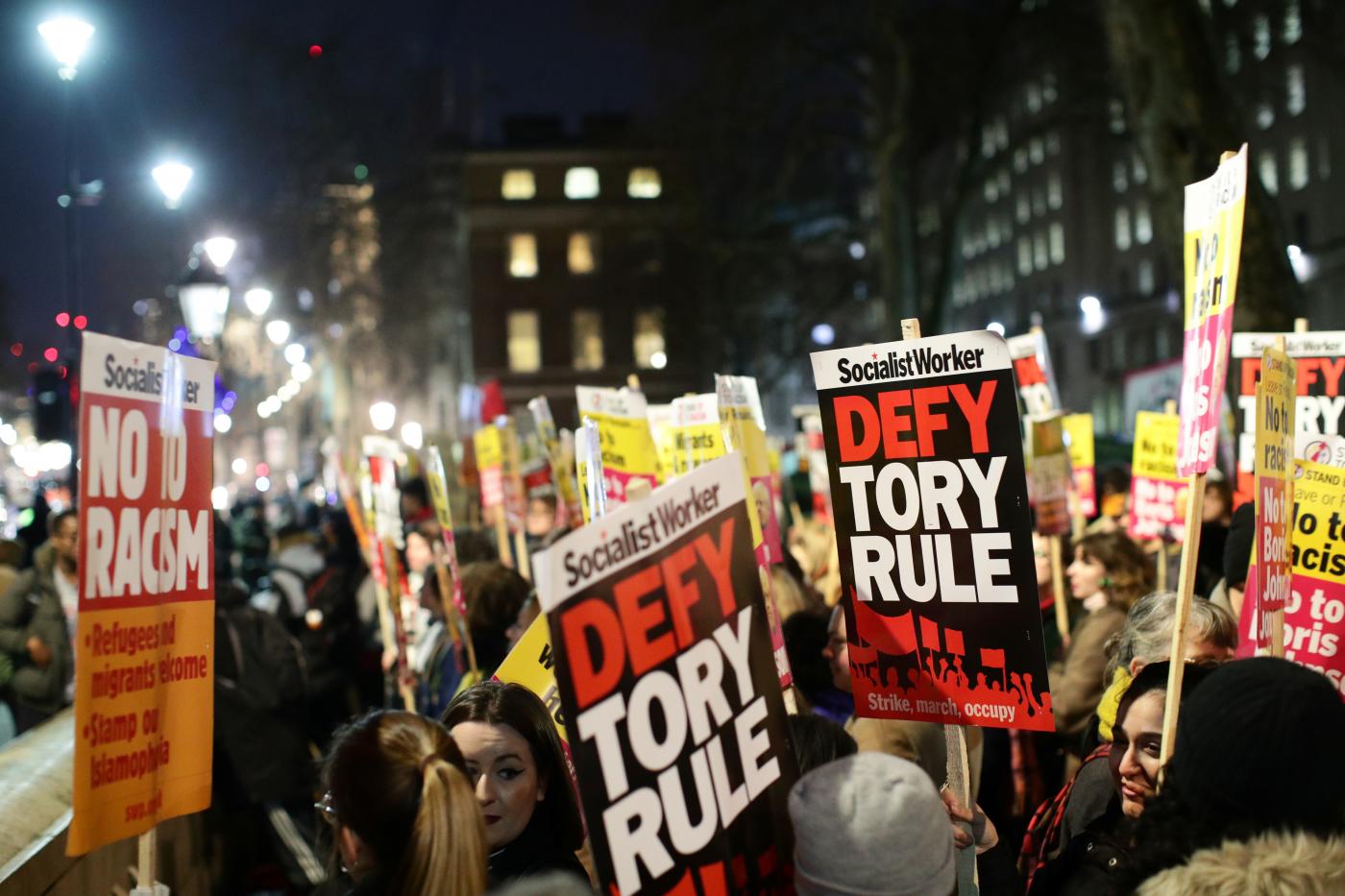 Protesters demonstrate at Downing Street following the result of the general election in London on 13 December (Reuters)