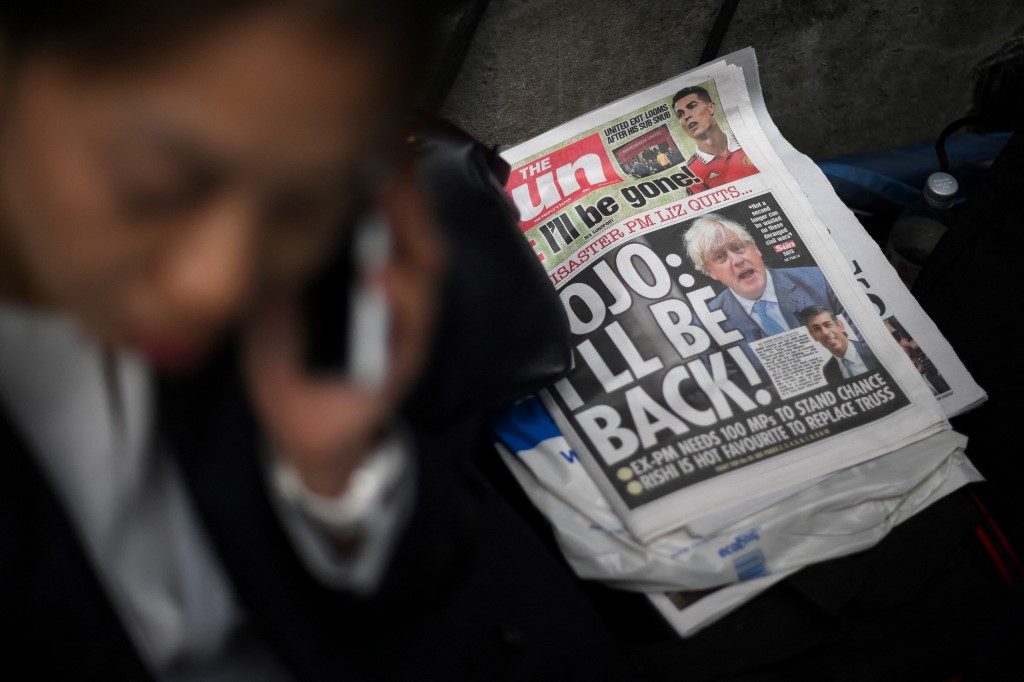 A copy of The Sun featuring Johnson is seen in London on 21 October 2022 (AFP)