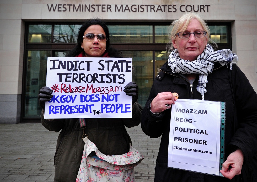 Protesters demonstrate outside Westminster Magistrates Court in London, on March 1, 2014, as former Guantanamo detainee Moazzam Begg appeared (AFP)