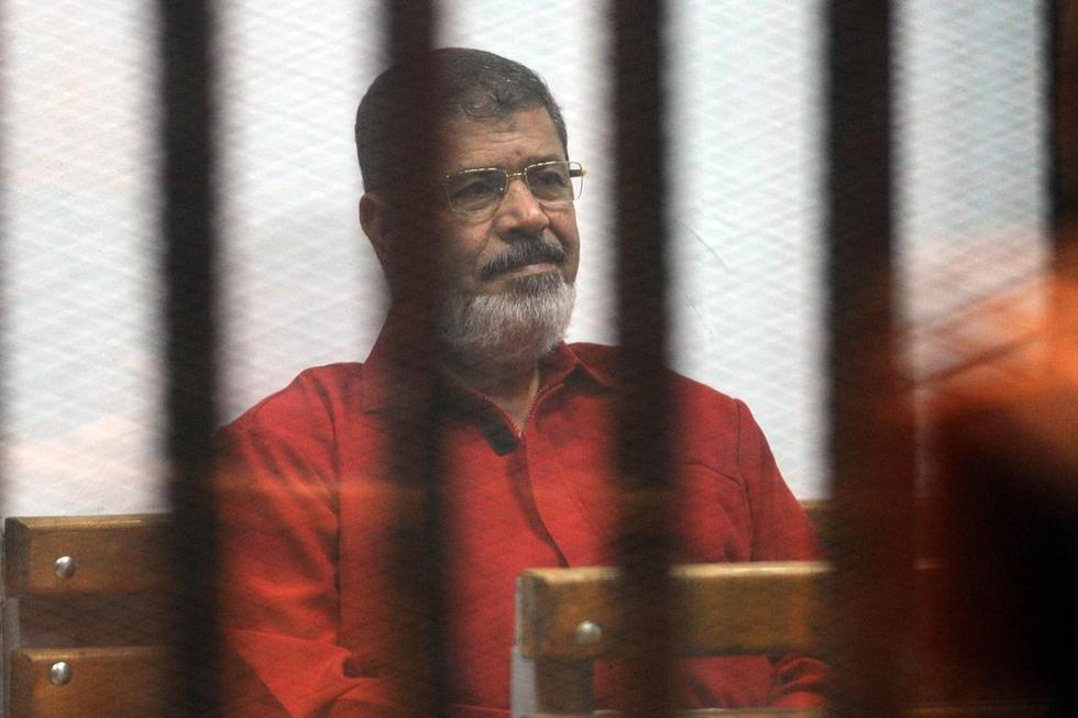 Mohamed Morsi was one of some 60,000 political prisoners detained since the 2013 coup that ousted him (Reuters)