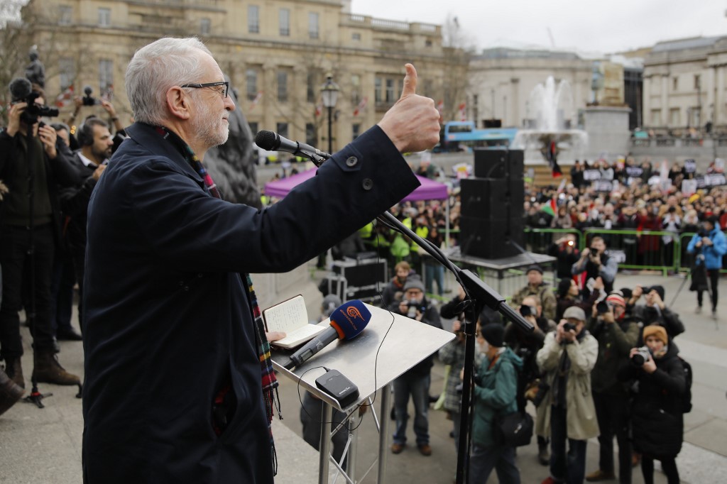 Corbyn speaks to anti-war demonstrators in central London on 11 January (AFP)