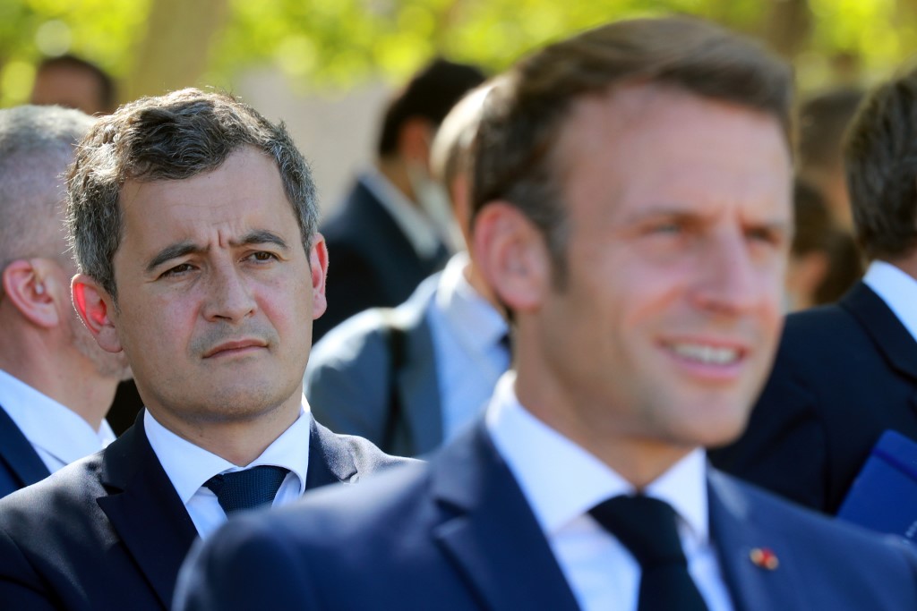 French Interior Minister Gerald Darmanin listens to French President Emmanuel Macron on 22 July 2020 at Chambord castle (AFP)
