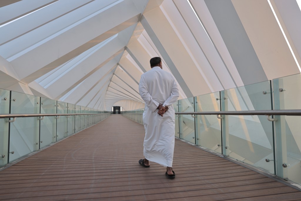 A man crosses the Tolerance bridge in the Gulf emirate of Dubai, on January 25, 2021.