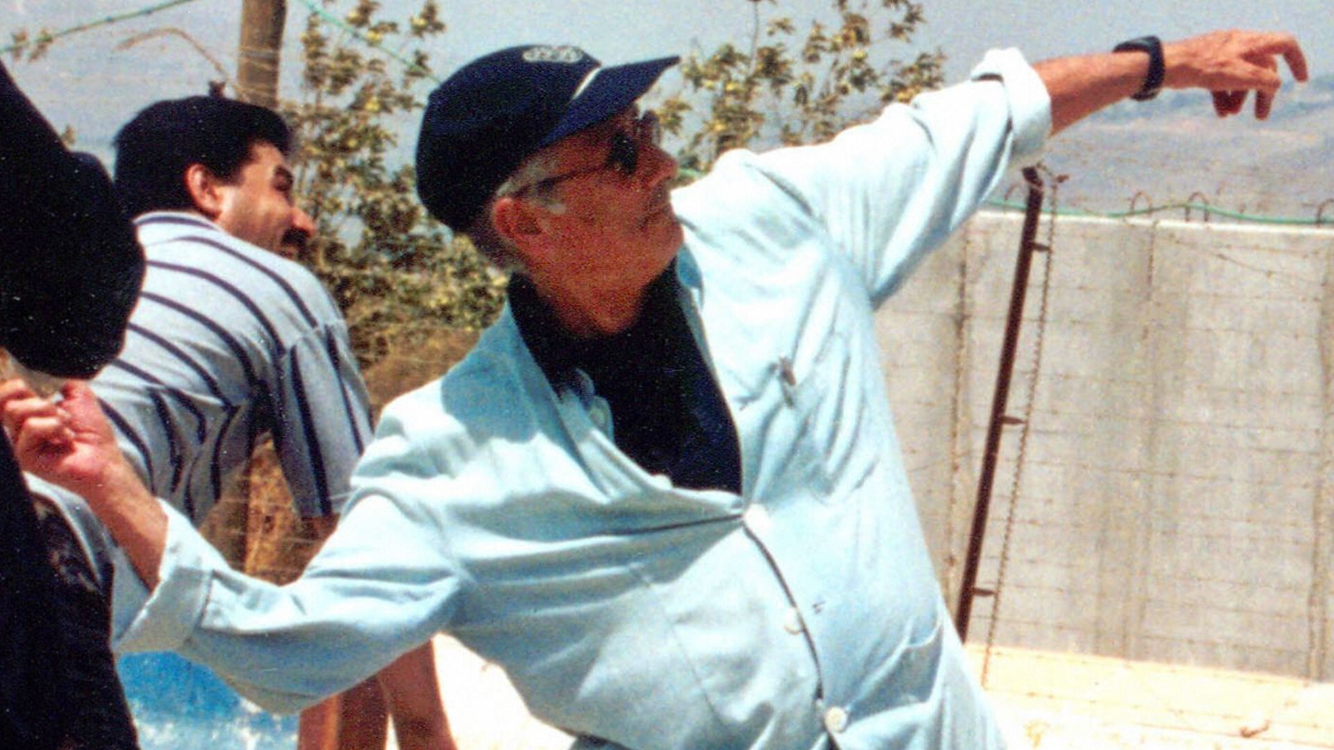 Edward Said launching a stone on the other side of Lebanon’s border with Israel from the southern Lebanese village of Kfar Kila on 3 July 2000 (AFP)