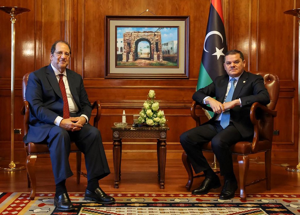 A handout picture released by the Egyptian State Information Service on June 17, 2021, shows Libyan Prime Minister Abdulhamid Dbeibah (R) meeting with Egyptian General Intelligence Directorate chief Abbas Kamel, in the Libyan capital Tripoli.