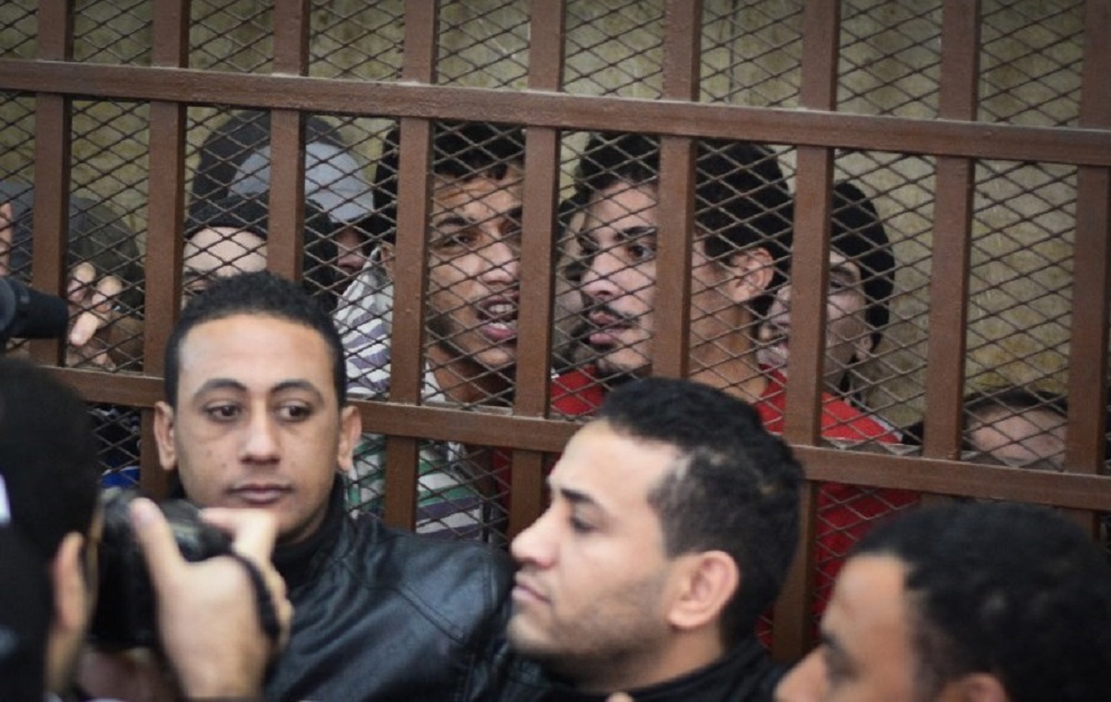 Defendants react behind the bars at a court in Cairo following the acquittal on 12 January 2015 of 26 men accused of "debauchery" after they were arrested in a night-time raid in a bathhouse (AFP)