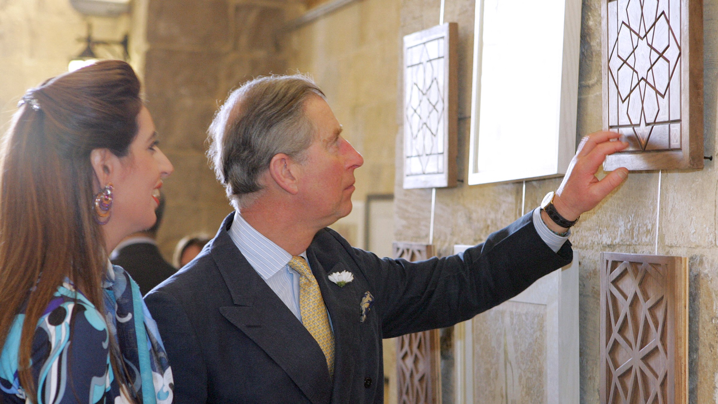 Britain's Prince Charles admires modern Islamic art pieces at the Qasr Al-Taz School for traditional arts in Cairo, during his tour of the city 21 March 200