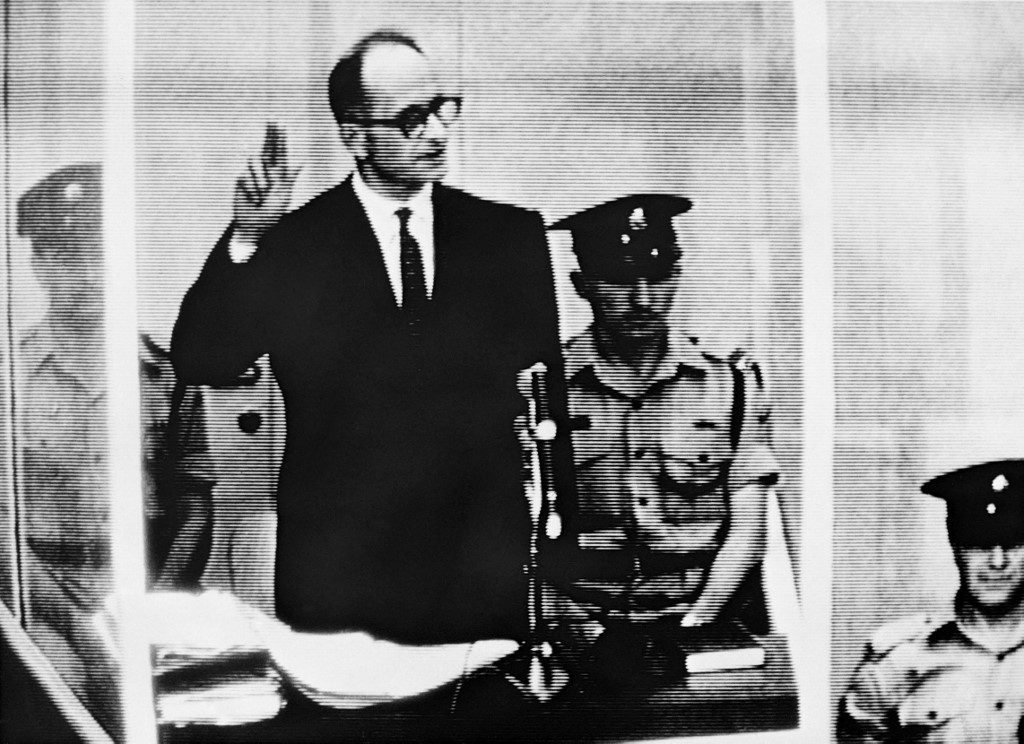 Nazi leader and war criminal Adolf Eichmann stands trial in Jerusalem in 1961 (AFP)