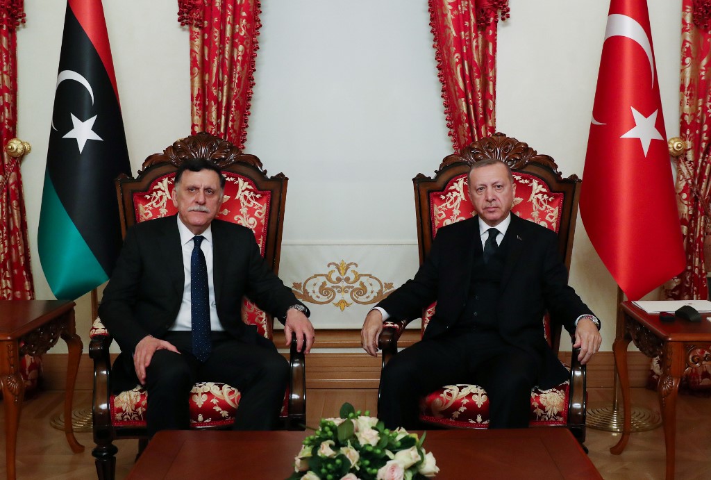 Libyan Prime Minister Fayez al-Sarraj and Turkish President Recep Tayyip Erdogan meet in Istanbul on 20 February (Murat Cetinmuhurdar/Turkish Presidential Press Service/AFP)