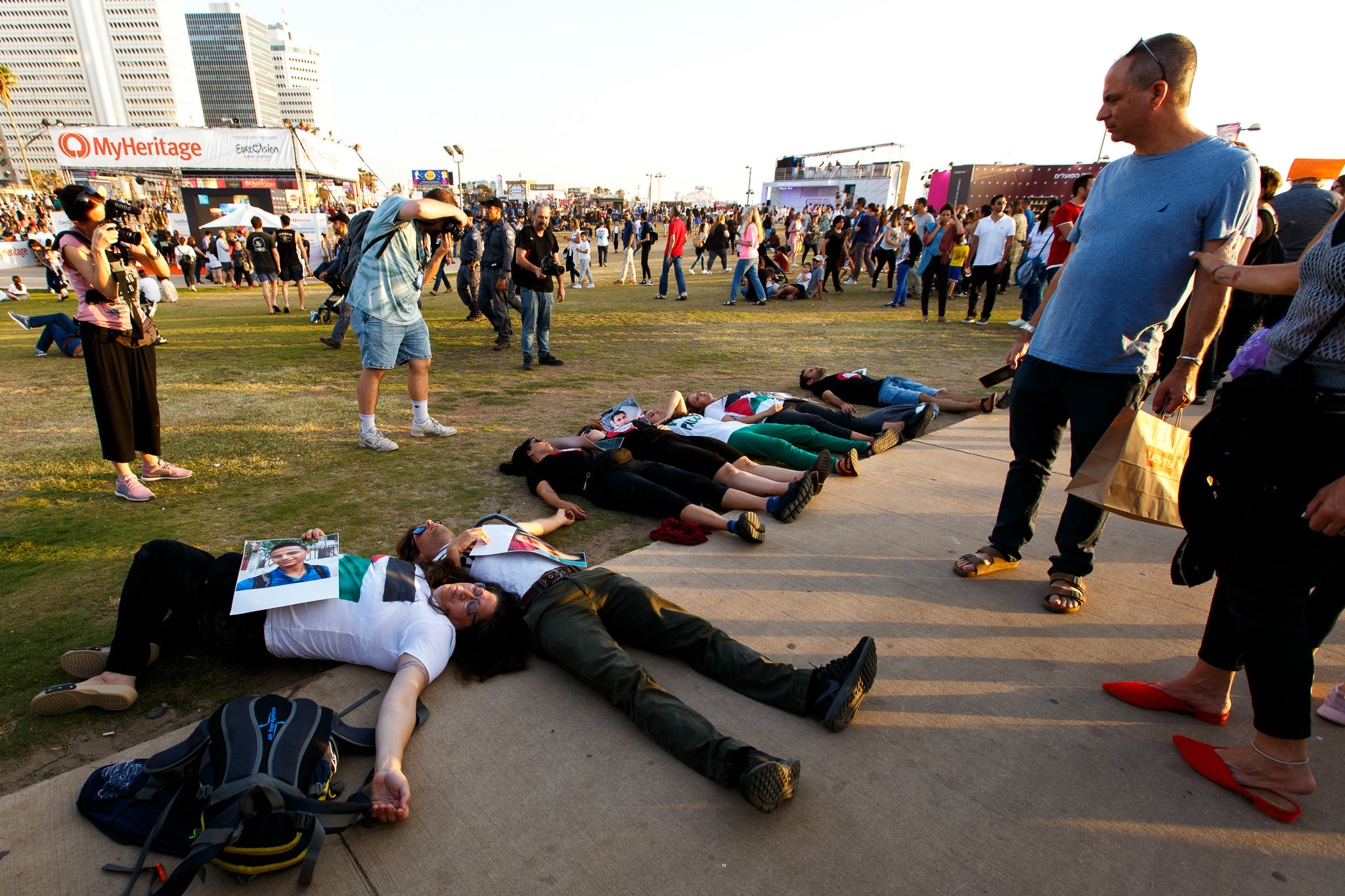 Israeli activists stage a "die-in" at the Eurovision village in Tel Aviv (MEE/Miriam Deprez)