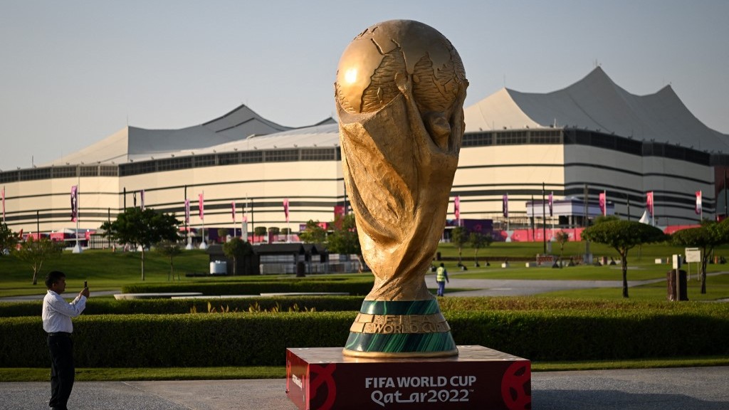 A replica of the Fifa World Cup trophy stands in front of al-Bayt Stadium in al-Khor, Qatar, on 10 November 2022 (AFP)
