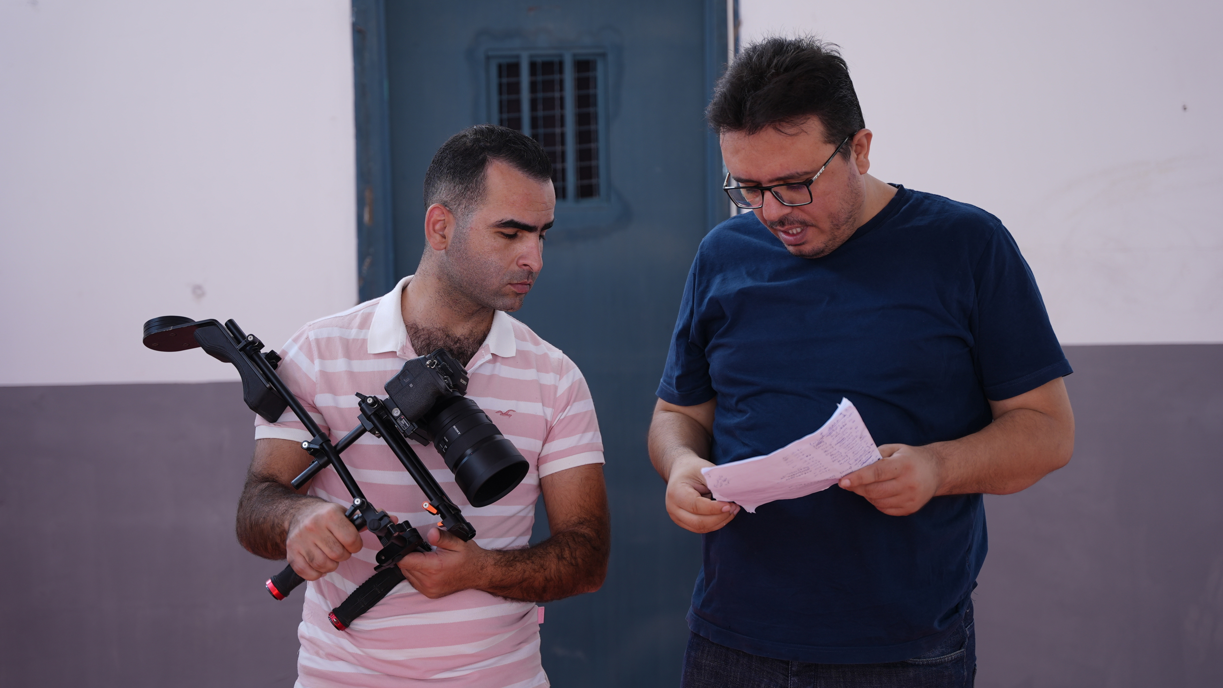 Director Mohammad Sawwaf (R) is pictured with photographer Salah Alhaw (Alef Multimedia Company/Mohammad Sawwaf for MEE)