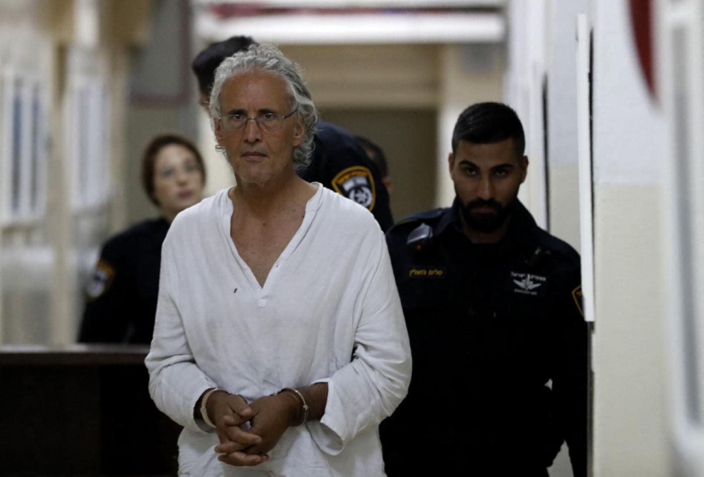 Frank Romano, who was arrested by Israel while protesting against the demolition of a Palestinian village in the West Bank, appears at the Jerusalem court on 16 September 2018 (AFP)