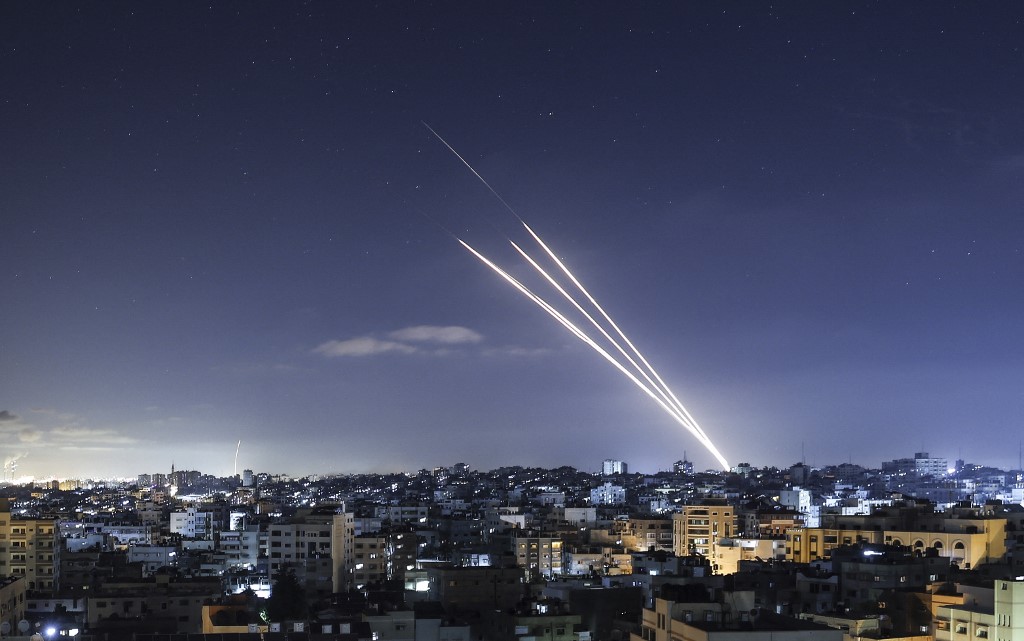 Rockets are launched towards Israel from Gaza City on 18 May 2021 (AFP)