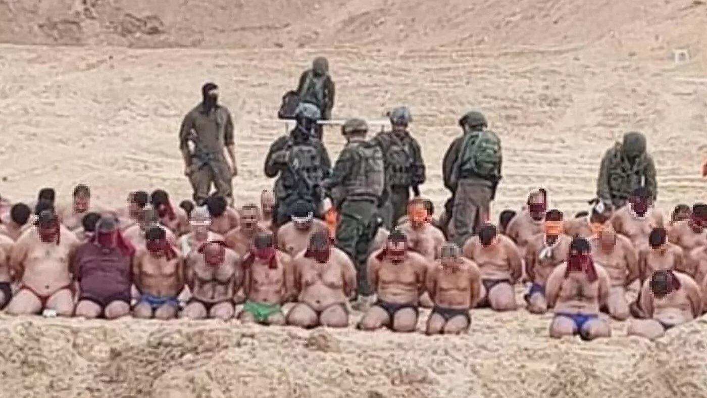 Palestinian men rounded up and stripped by Israeli forces in Gaza before being taken to an undisclosed location (Screengrab/X)