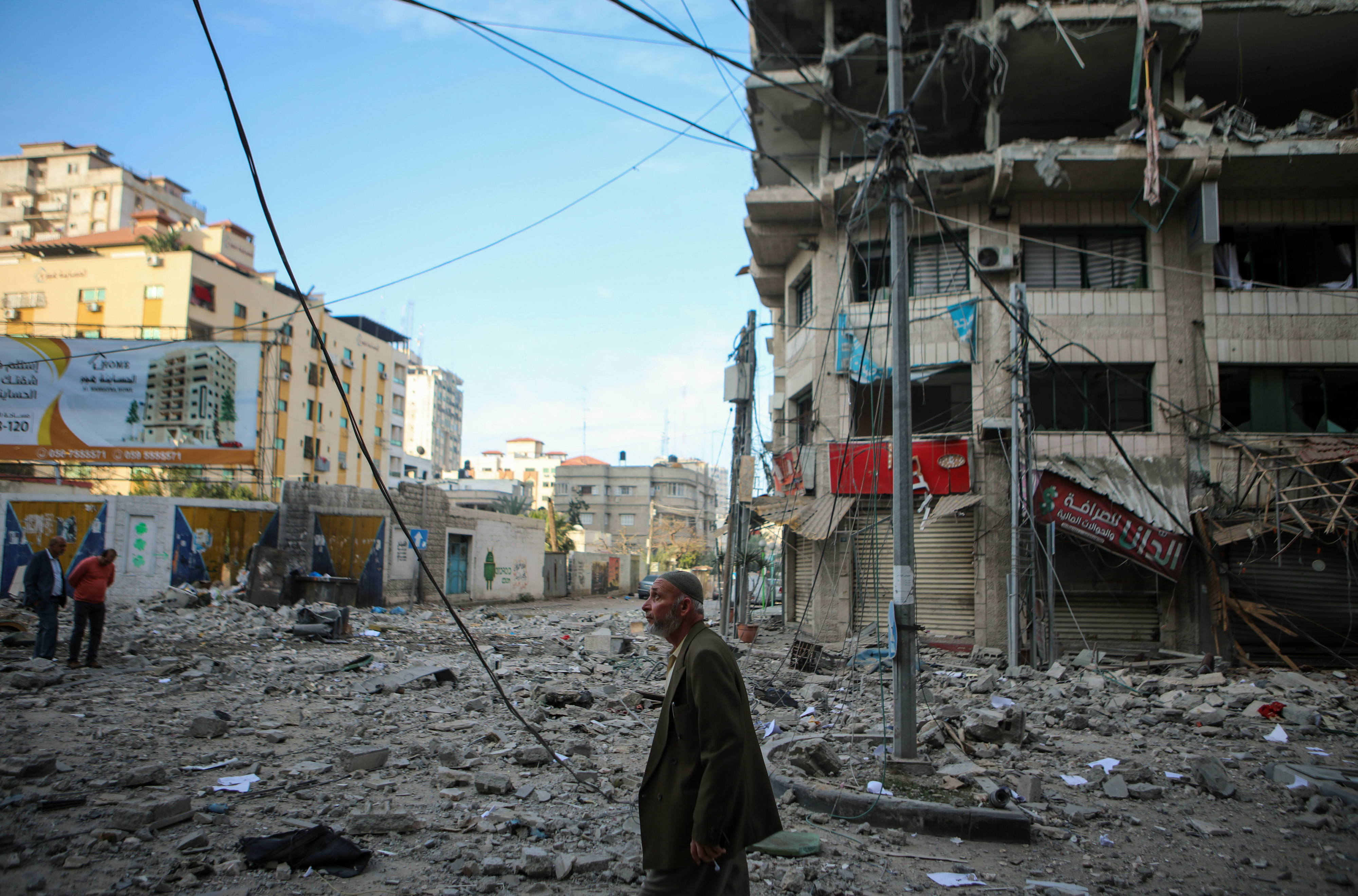 A man inspects damage in Gaza on Sunday morning following Israeli strikes (MEE/Mohammed al-Hajjar)