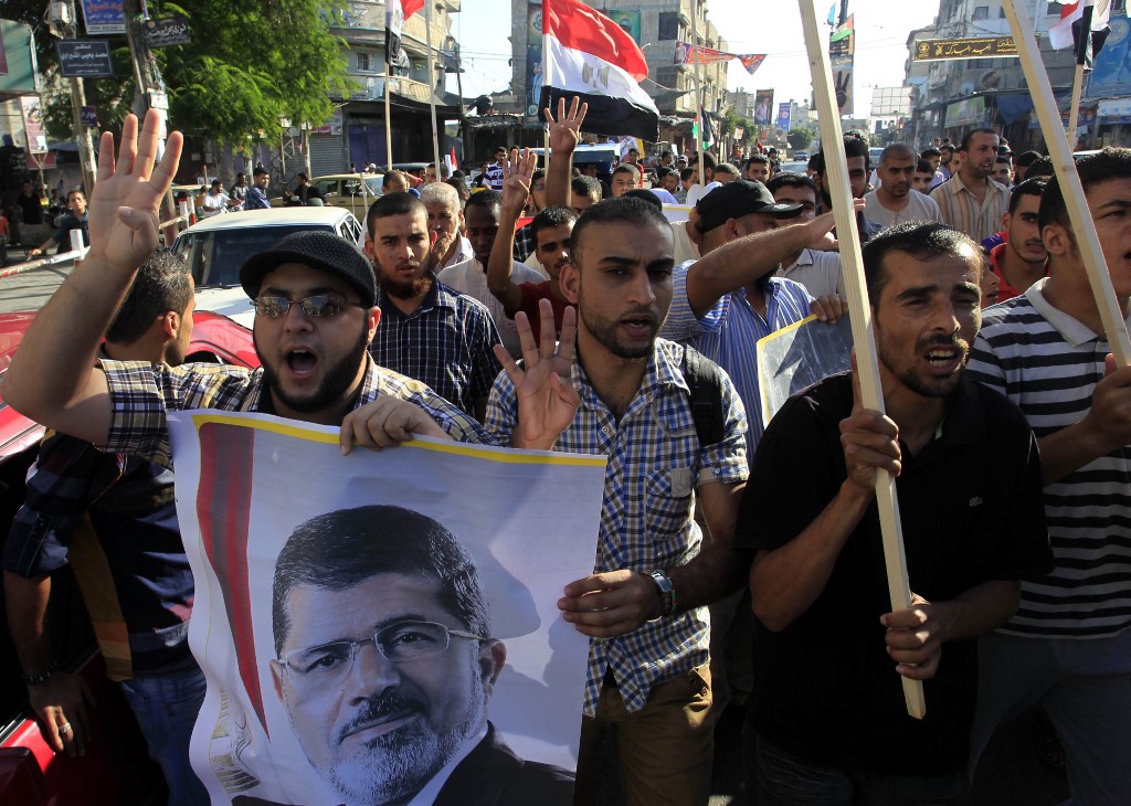 Palestinians in Gaza demonstrate in support of Morsi in 2013 (AFP)
