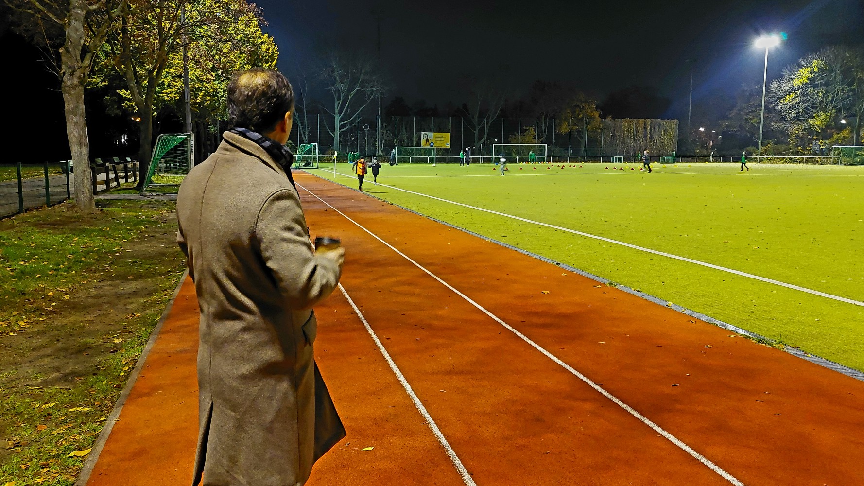 Sezgin Aksakal watches from the sidelines at his 11-year-old son's football practice (MEE/Sal Ahmed)
