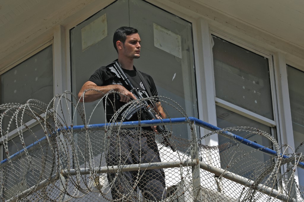 A police officer keeps watch from an observation tower at Gilboa prison in northern Israel on 6 September 2021 (AFP)