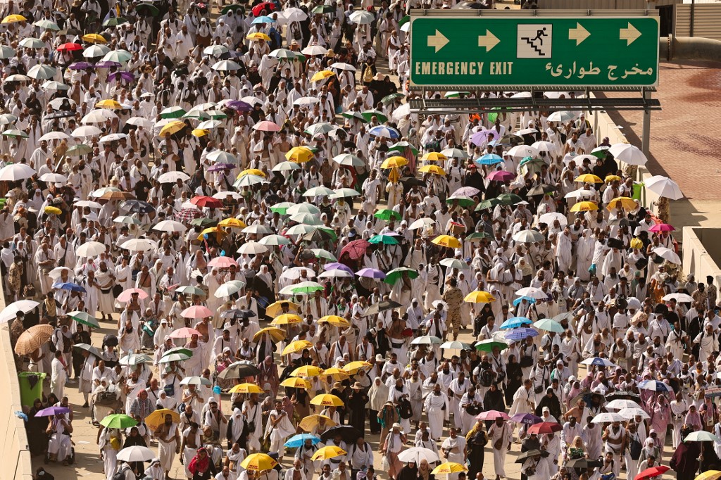 Muslim pilgrim arrive to perform the symbolic 'stoning of the devil' ritual during the annual hajj pilgrimage in Mina on June 16, 2024. Friends and family searched for missing hajj pilgrims on June 19 as the death toll at the annual rituals,