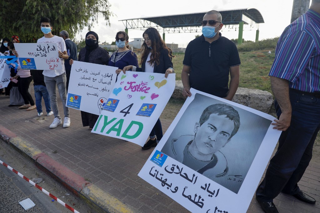 Demonstrators in Tayibe, Israel, protest the killing of Iyad al-Halak in June 2020 (AFP)