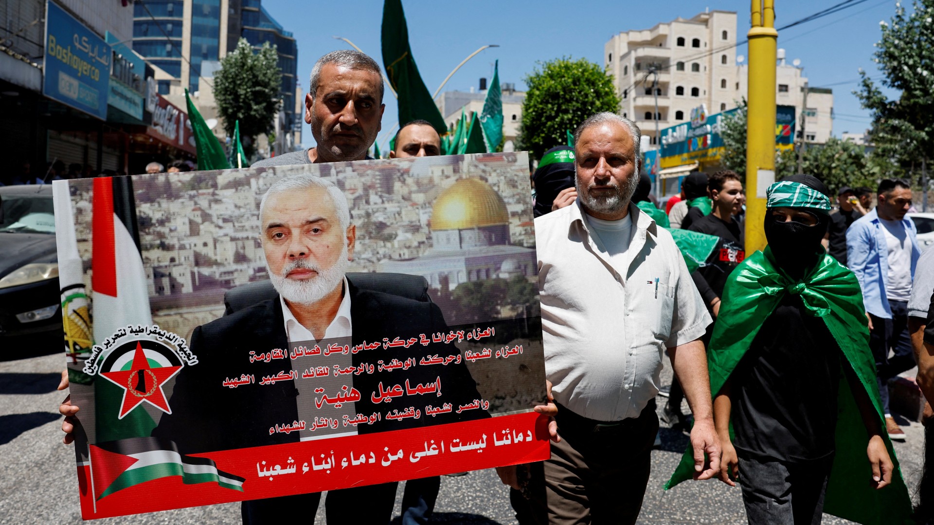 Palestinians attend a protest after the assassination of Hamas leader Ismail Haniyeh in Iran, in Hebron in the Israeli-occupied West Bank 31 July, 2024. (Reuters/Mussa Qawasma)