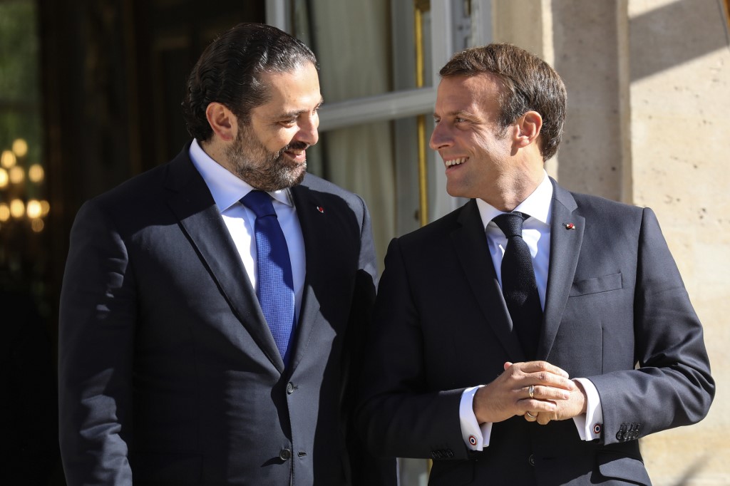 Lebanese Prime Minister Saad Hariri speaks with French President Emmanuel Macron in Paris in September 2019 (AFP)