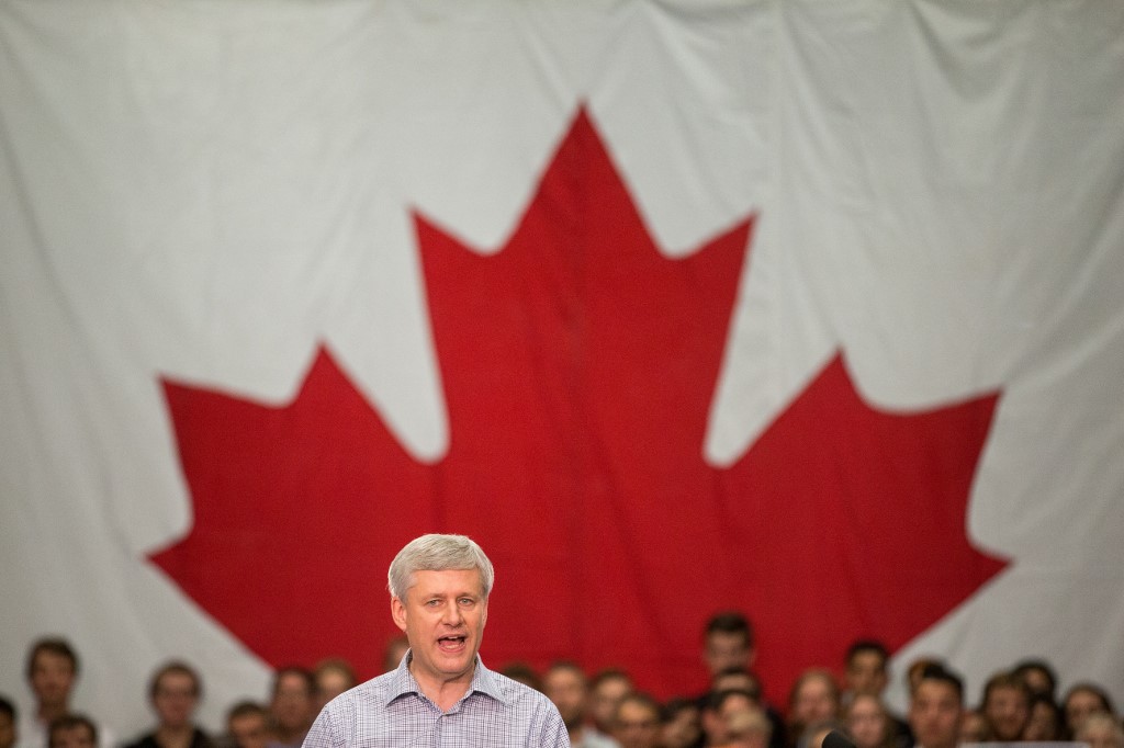 Then-conservative leader Stephen Harper speaks to supporters at a rally in London, Ontario, Canada in 2015 (AFP)