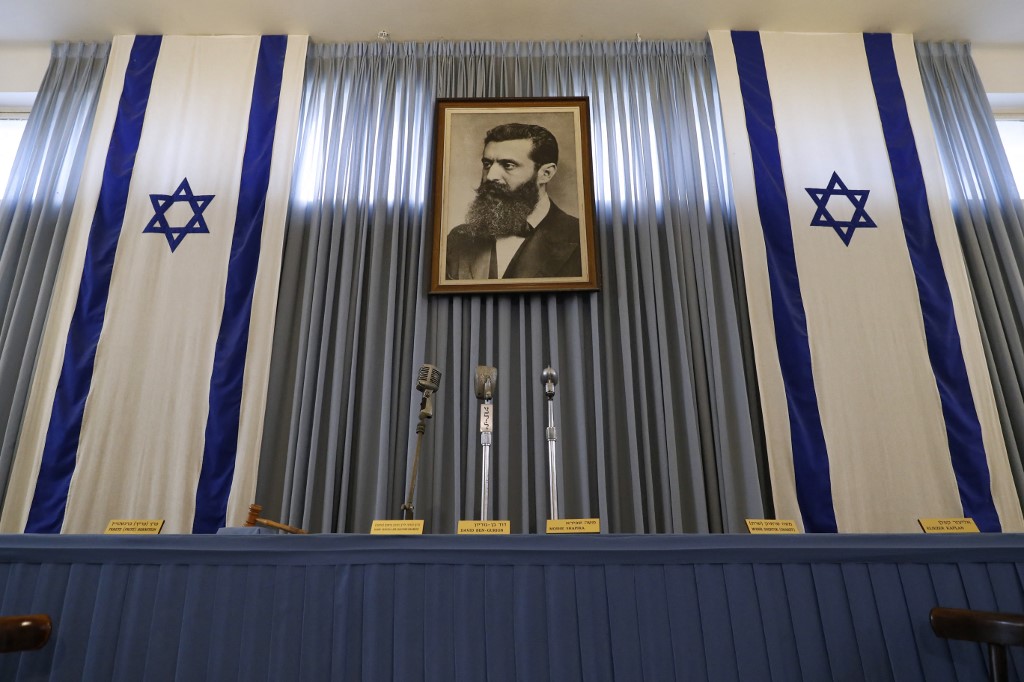 A portrait of Theodor Herzl, the late founder of political Zionism, is seen in Tel Aviv in 2018 (AFP)