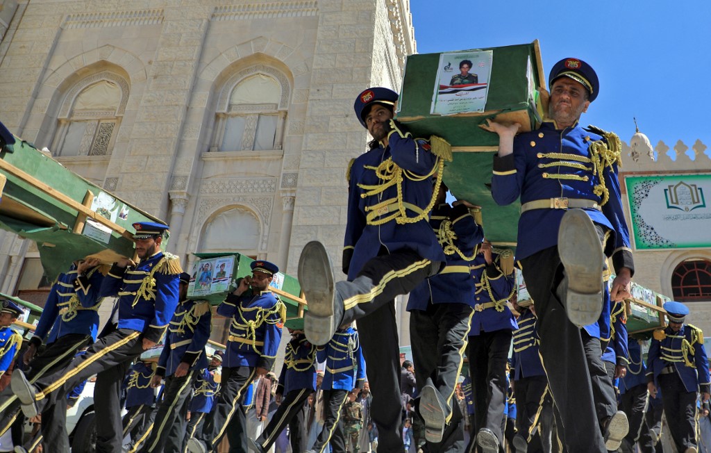 Forces loyal to Yemen's Huthi rebels carry the coffins of fighters killed in battles with Saudi-backed government troops in the Marib region, during a mass funeral at the capital Sanaa's al-Saleh Mosque, on October 28, 2021.