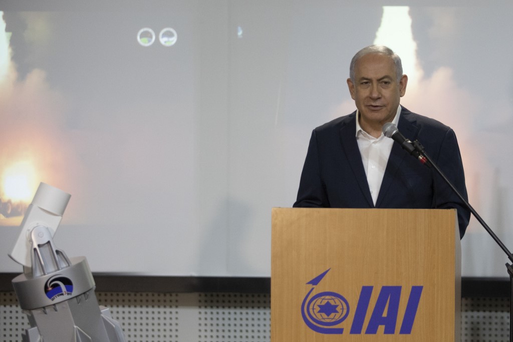 Israeli Prime Minister Benjamin Netanyahu speaks at an IAI plant in January 2019 (AFP)