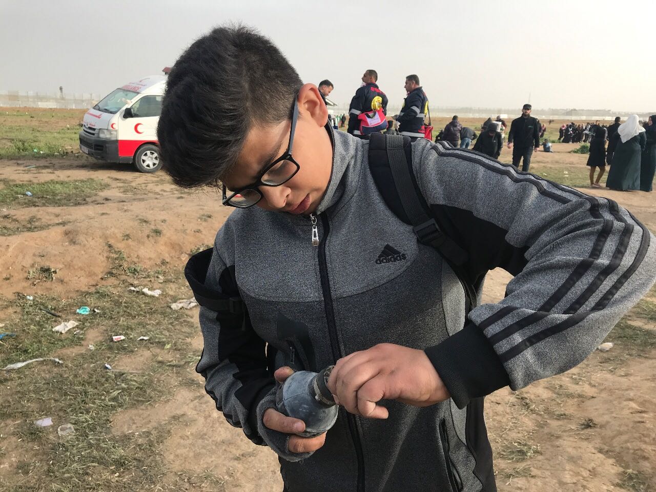 Hussein Swedan, 15, plays with an empty teargas canister (MEE)