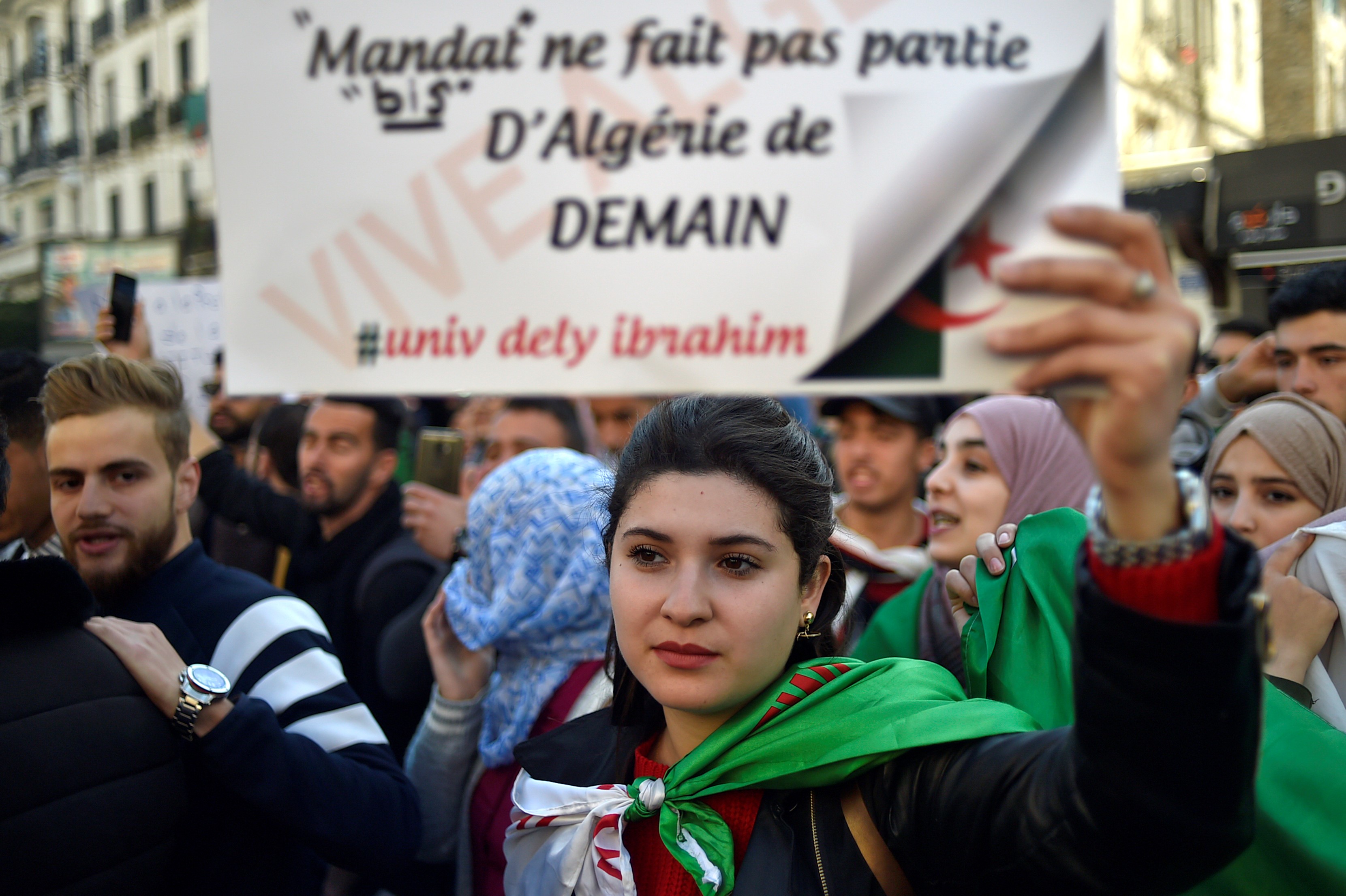Algerian students demonstrate in the centre of the capital Algiers on March 12 (AFP)