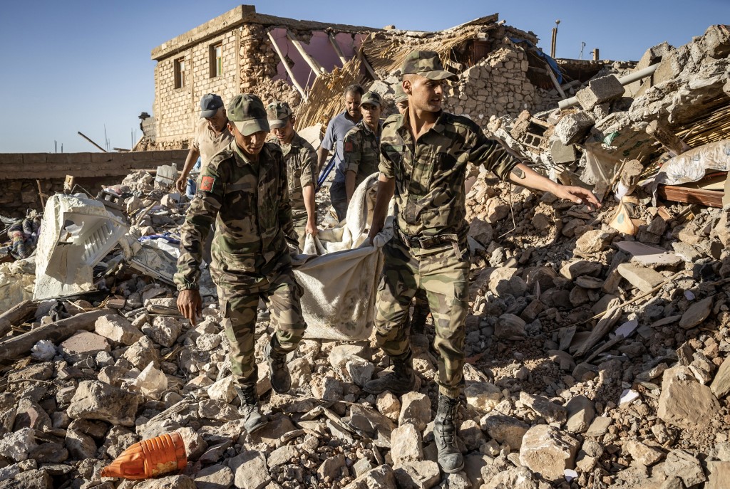 Moroccan Royal Armed Forces evacuate a body from a house destroyed in an earthquake in the mountain village of Tafeghaghte, southwest of the city of Marrakesh, on September 9, 2023. 